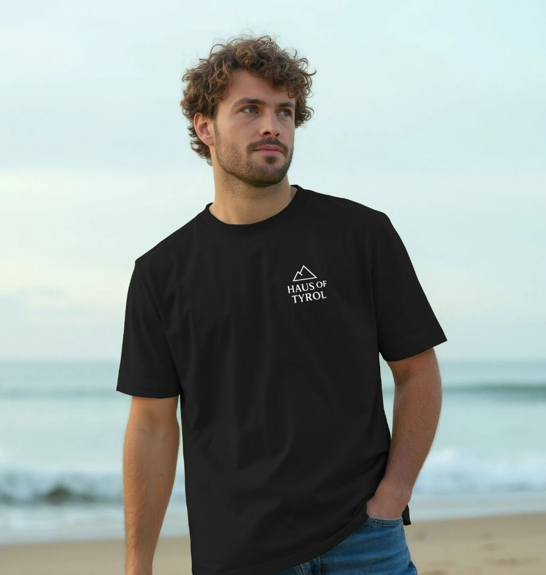 Black Tyrolean Man Dark Tee model lifestyle beach shot