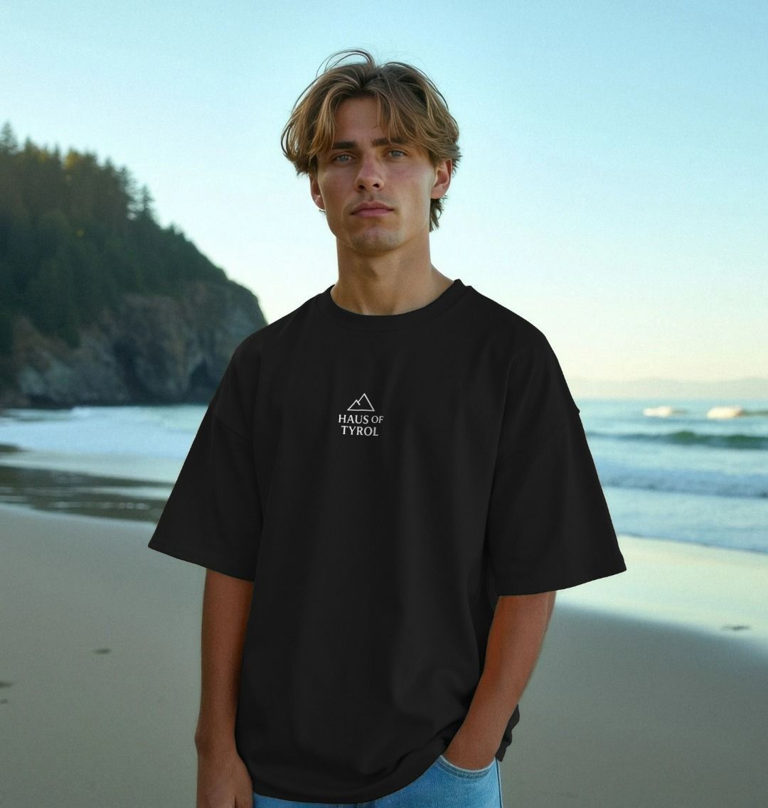 Oversized Signature Alpine Style Tee model on beach wearing shirt