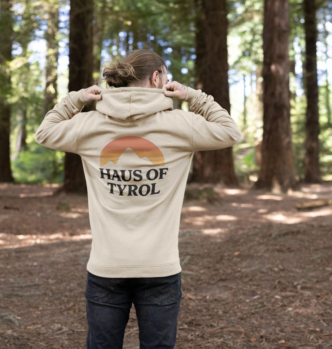Oat Sunset Hoodie model in forest showing back sunset mountain graphic